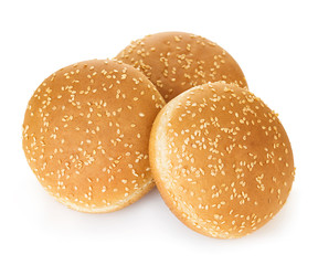 Burger bun with sesame seeds isolated on white background with clipping path.