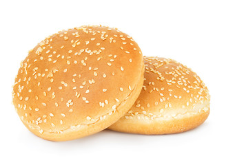 Two hamburger buns with sesame isolated on white background.