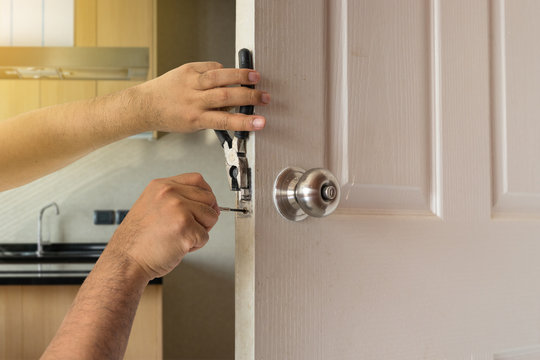 locksmith fix door by screwdriver in kitchen house