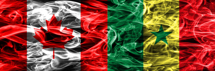 Canada vs Senegal smoke flags placed side by side. Canadian and Senegal flag together
