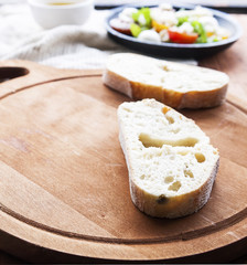 Mozzarella cheese, cherry tomatoes and arugula pesto bruschetta on light background, top view. Arugula pesto and sandwiches - tasty snack, snack, tapas