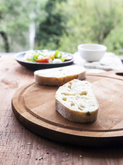 Mozzarella cheese, cherry tomatoes and arugula pesto bruschetta on light background, top view. Arugula pesto and sandwiches - tasty snack, snack, tapas