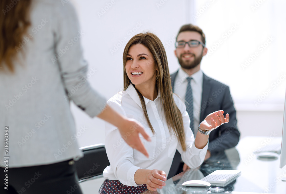 Canvas Prints smiling employees talking in the workplace.