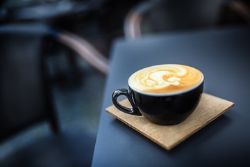 Coffee and latte art on table terrace in restaurant