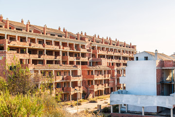 Unfinished residential buidlings in Andalucia Spain abandoned after the property bubble burst with...