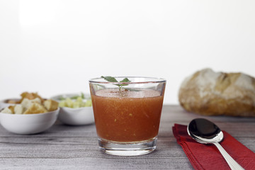 glass of Andalusian gazpacho with garnish