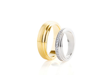 Gold and silver wedding rings isolated on white