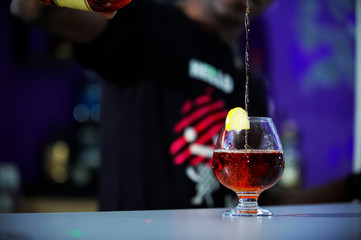 Night bar and club "Escape", barman is African.