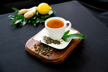 Obraz na płótnie Canvas Cup of tea and mint on a dark background