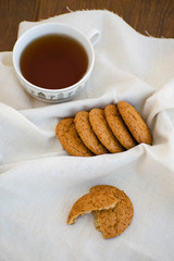 Homemade oatmeal cookies with raisins. Healthy biscuits. Morning cup of tea with oatmeal cookies.