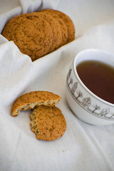 Homemade oatmeal cookies with raisins. Healthy biscuits. Morning cup of tea with oatmeal cookies.