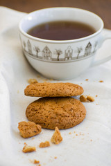 Homemade oatmeal cookies with raisins. Healthy biscuits. Morning cup of tea with oatmeal cookies.