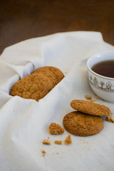 Homemade oatmeal cookies with raisins. Healthy biscuits. Morning cup of tea with oatmeal cookies.
