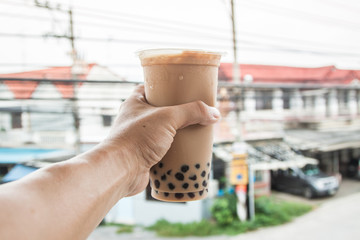 ice milk with bubble and boba in the plastic glass 