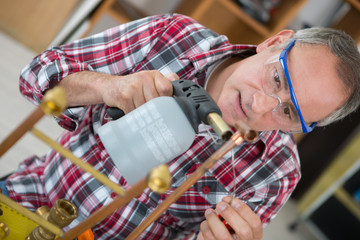 worke using blowtorch for soldering copper fittings