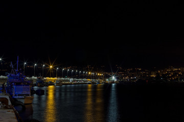 Fototapeta na wymiar night harbor with lanterns alley way