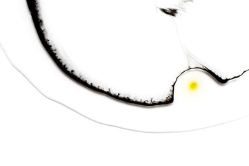 Abstract ink background. Moving liquid paint in water. Black thin circle with yellow oil dot
