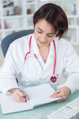 writing prescription after diagnosing sick patient