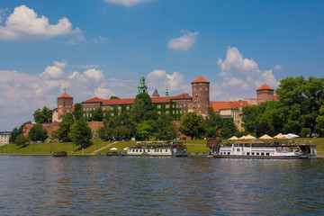 Fototapeta premium Wawel Castle Viewed from the Vistula river. The belltower of Wawel Cathedral can also be seen 