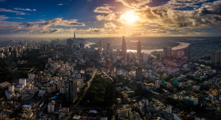 Aerial view of Ho Chi Minh City skyline and skyscrapers in center of heart business at Ho Chi Minh City downtown. Panorama of cityscape on Saigon river in Ho Chi Minh City at Vietnam at sunrise scene