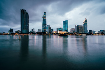 Beautiful view of Ho Chi Minh City skyline and skyscrapers in center of heart business at Ho Chi Minh City downtown. Panorama of cityscape on Saigon river in Ho Chi Minh City at Vietnam at sunset 