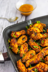 Spicy Chicken Wings Served with Cilantro