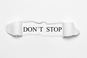 Fototapeta premium Don´t Stop on white torn paper