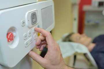Naklejka premium closeup of hand on medical controls in hospital