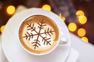Cappuccino with a pattern of snowflakes