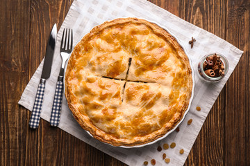 Tasty homemade apple pie on wooden table