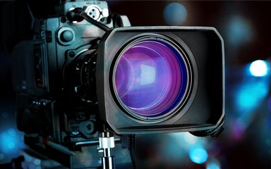 Professional video camera on dark background