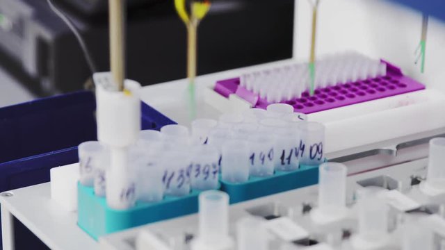 In the medical center in the laboratory, the robot automatically analyzes the detection of cancer cells in patient samples. Prevention and diagnosis of women's cancer