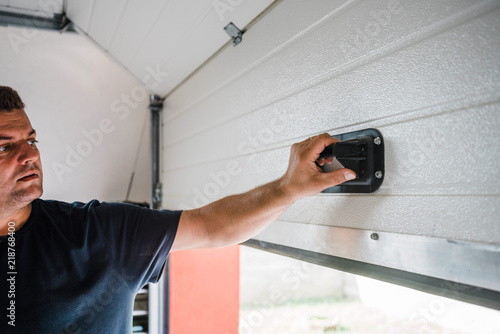 Man Opens Pvc Garage Door Manually Stock Photo And Royalty