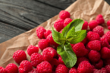 Fresh ripe raspberries on parchment, closeup