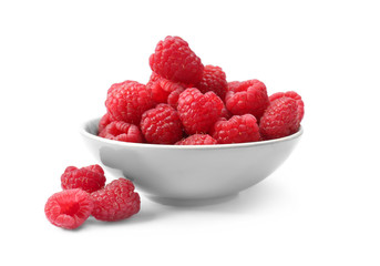 Bowl with fresh ripe raspberries on white background