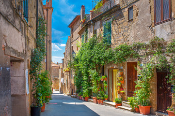 Beautiful flower street in a medieval village in Tuscany. Pitigliano. Italy