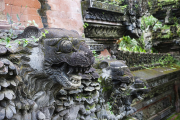 Fototapeta na wymiar Lions - sculpture of traditional Hindu temple in Ubud, Bali