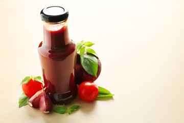 Bottle with tasty barbecue sauce on table