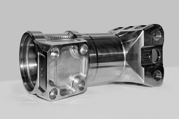 Metal industrial part of rectangular and round shape. Black and white