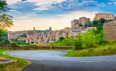 Fototapeta na wymiar Panorama of the picturesque medieval village of Sorano located on a hill at sunset, Tuscany. Italy