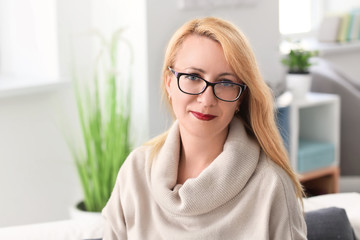 Portrait of attractive mature woman at home