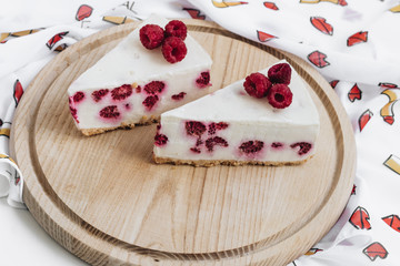 Two pieces of delicious cake with raspberries, sweet dessert