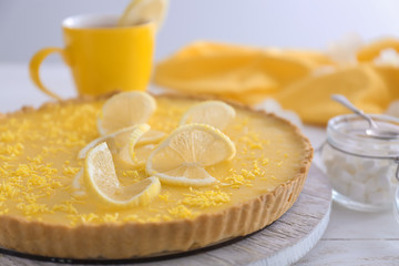 Tasty lemon pie on table, closeup
