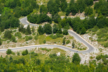 Aerial view of curvy road in the Albanian Alps mountain
