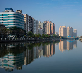 Tainan Anping canal river view with buildings water reflection and Tainan skyline cityscape in Taiwan