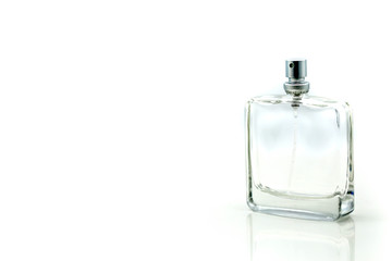 Perfume bottle , spraying perfume on white background, closeup