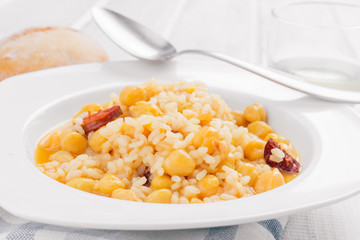 dish of homemade chickpeas on white wooden board