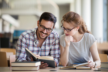 Young woman and man studying for an exam