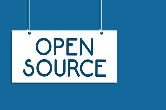 Text sign showing Open Source. Conceptual photo denoting software which original source code freely available Hanging board communicate information open close sign blue background.