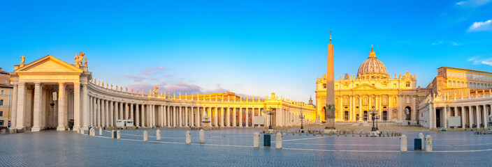 Fototapeta na wymiar Panorama of St. Peter's Square illuminated by the first rays of the morning sun, the Vatican. Italy
